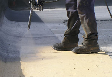 Coating systems over Baltimore spray foam roof systems